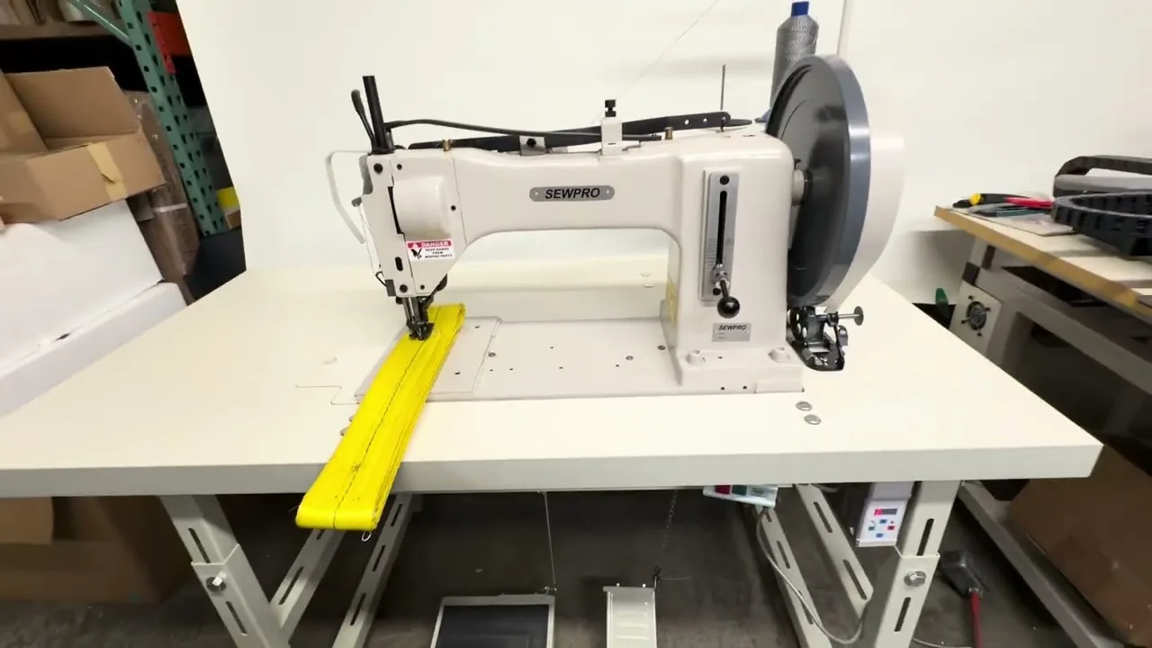 A SEWPRO 733 extra heavy-duty sewing machine on its table in the Ephrata shop